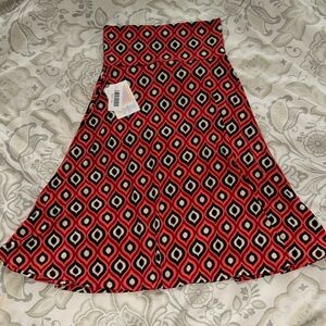 NWT Orange, cream, and black stretchy flare skirt. Size XS